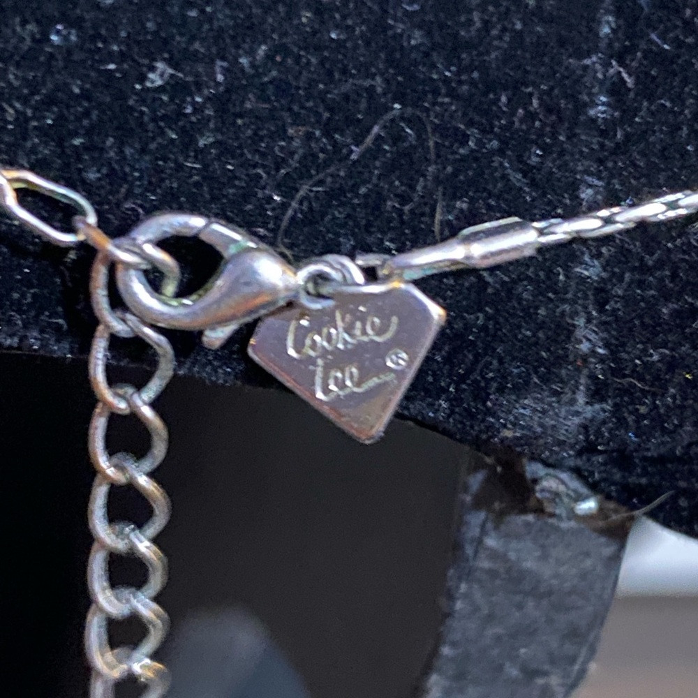 Eternity circle with heart , lock, key , bird and locket charms.